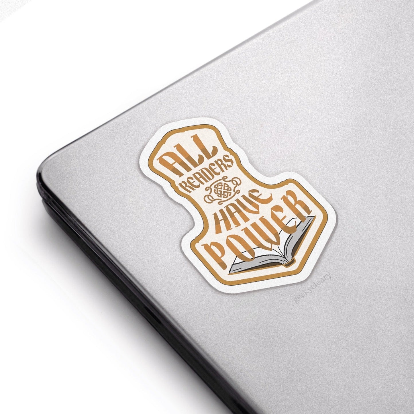 Sticker with All Readers Have Power original crest design in the hammer shape on a laptop.
