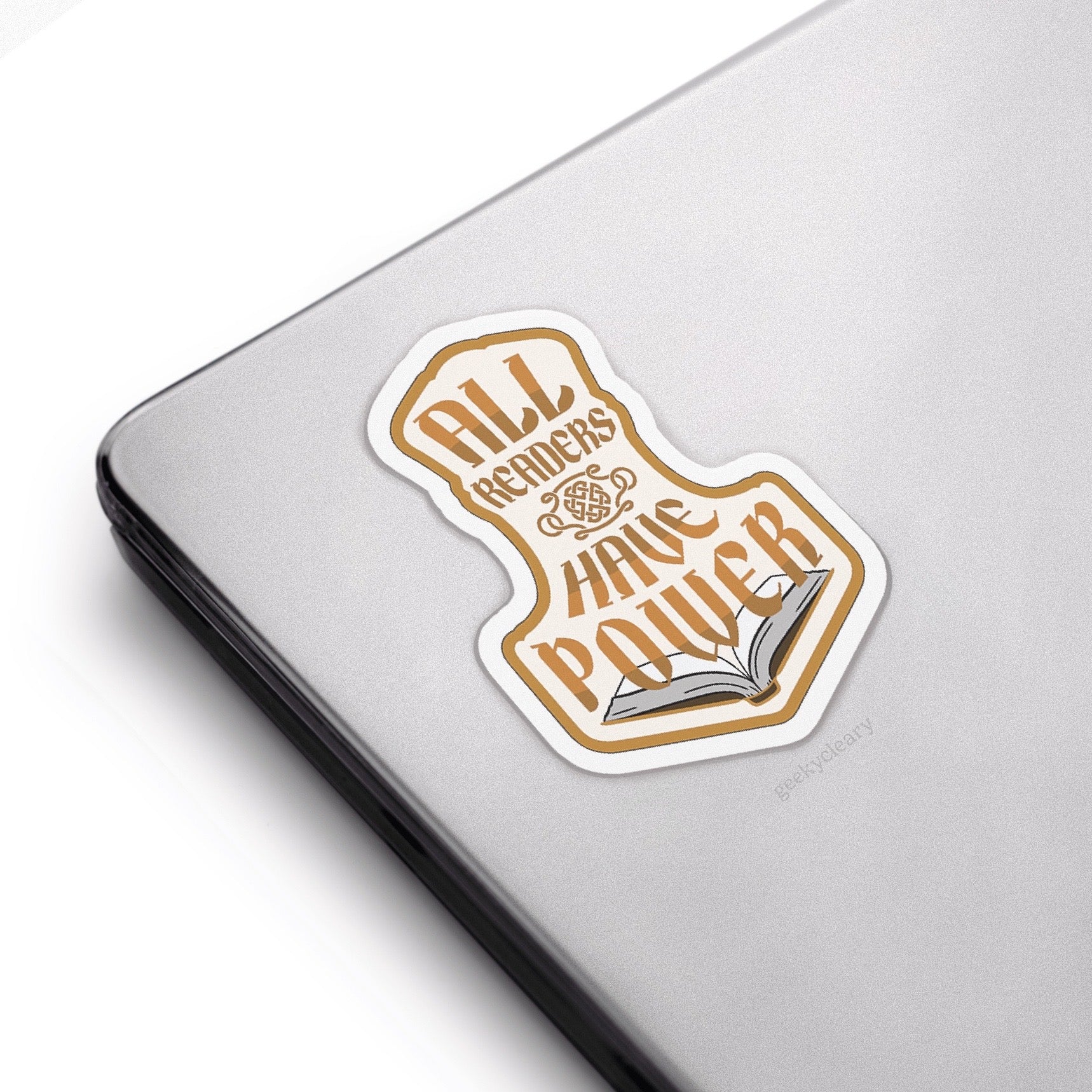 Sticker with All Readers Have Power original crest design in the hammer shape on a laptop.