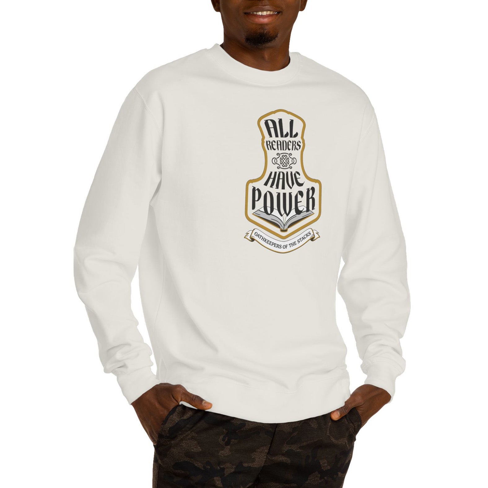 All Readers Have Power reader armor sweatshirt front in ivory worn by a book lover in camo pants.   