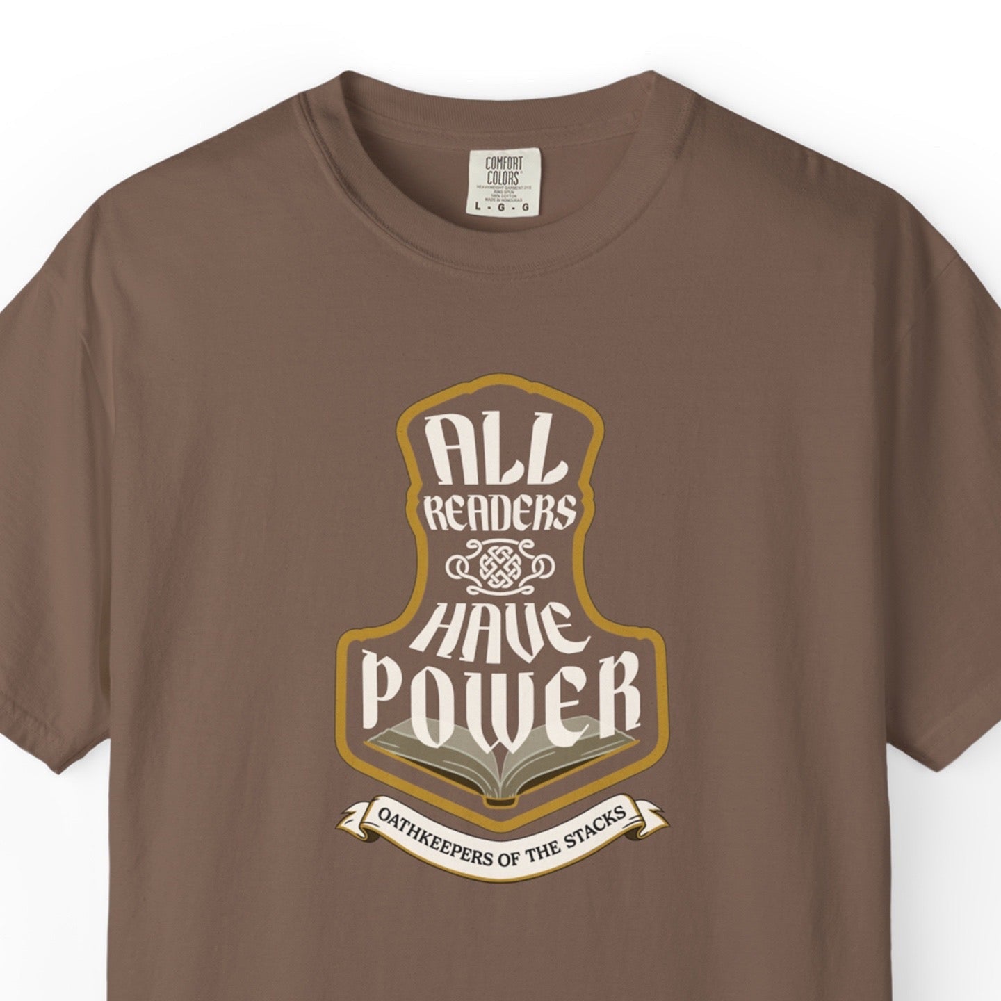 Espresso fantasy reader tee closeup with All Readers Have Power hammer emblem on the chest.