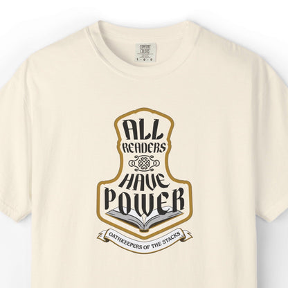 Ivory fantasy reader tee closeup with All Readers Have Power hammer emblem on the chest.
