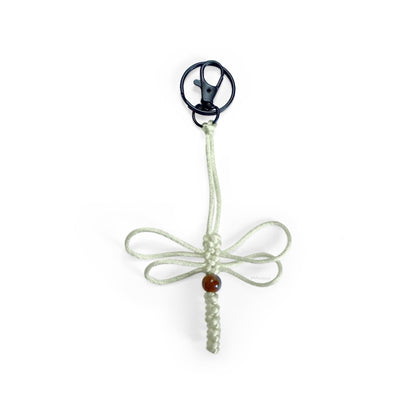 Bone-colored dragonfly limited series keychain handwoven with silk cord & real agate bead. Made with durable clip & keyring.