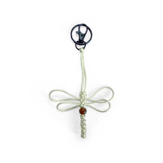 Bone-colored dragonfly limited series keychain handwoven with silk cord & real agate bead. Made with durable clip & keyring.