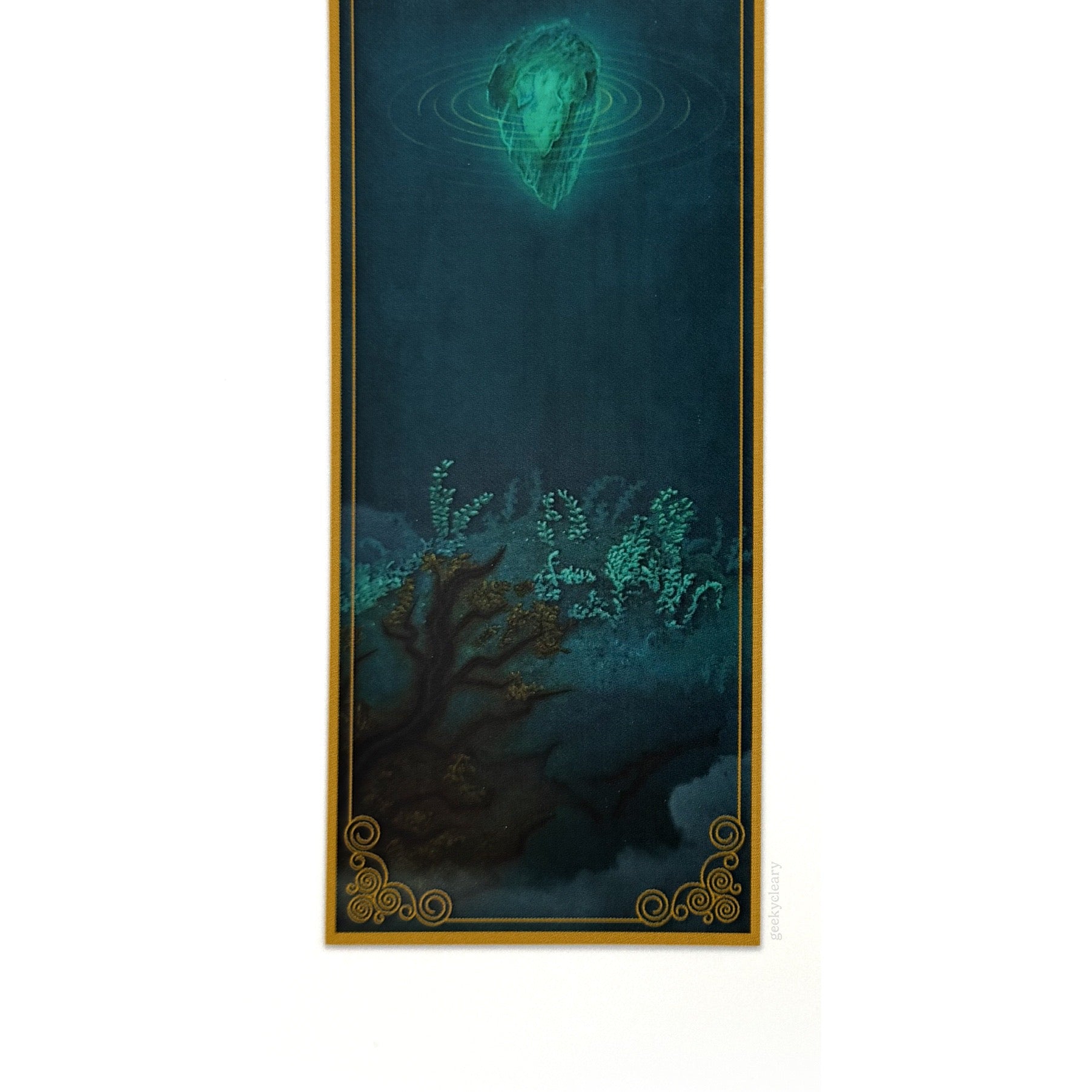 Bottom view close-up of Floating Crystalized Magic bookmark showing the crystal artwork and filigree border detail.