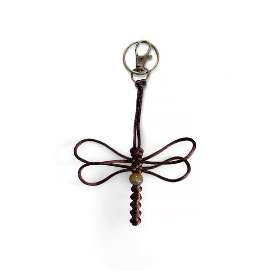 Deep red-colored dragonfly keychain handwoven with silk cord and real agate bead. Durable brass colored clip and keyring.