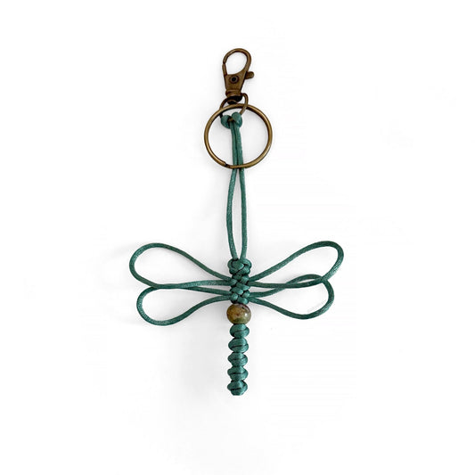 Teal-colored dragonfly keychain handwoven with silk cord and an real agate bead.