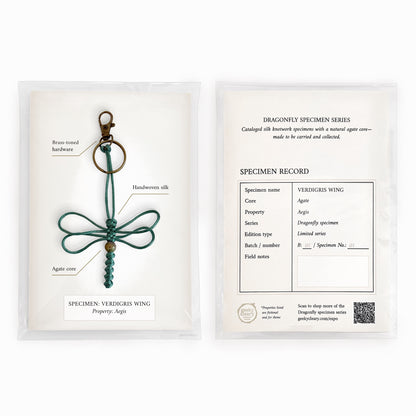 Verdigris wing dragonfly keychain handmade with teal silk cord in specimen series packaging.